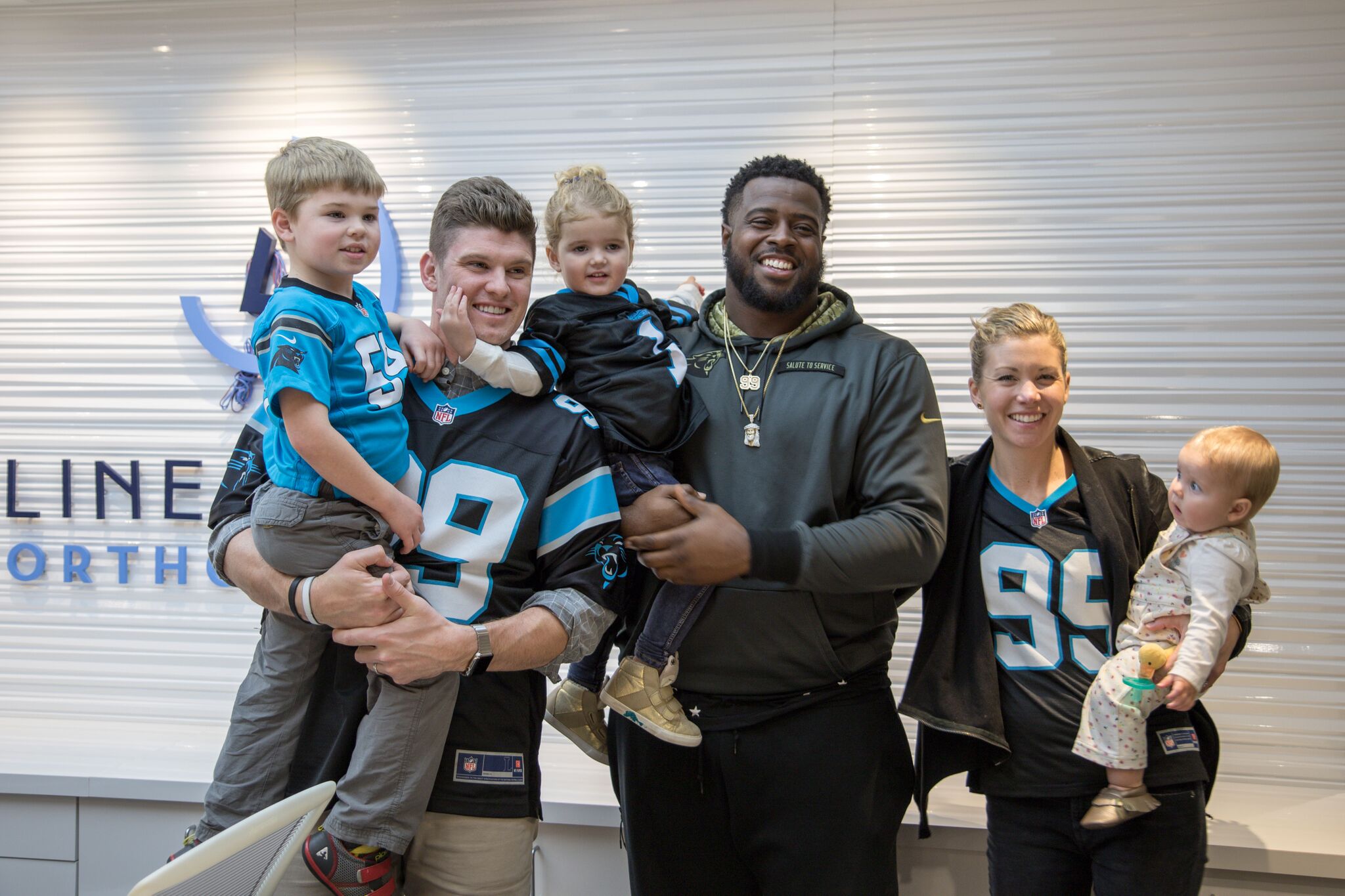 Kawann Short of the Carolina Panthers and Drs. Megan and Matt Lineberger in Charlotte, Huntersville, and Mooresville