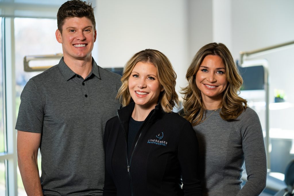 Dr. Matthew Lineberger, Dr. Megan Lineberger, and Dr. Claire Fedore of Lineberger Orthodontics in Huntersville NC